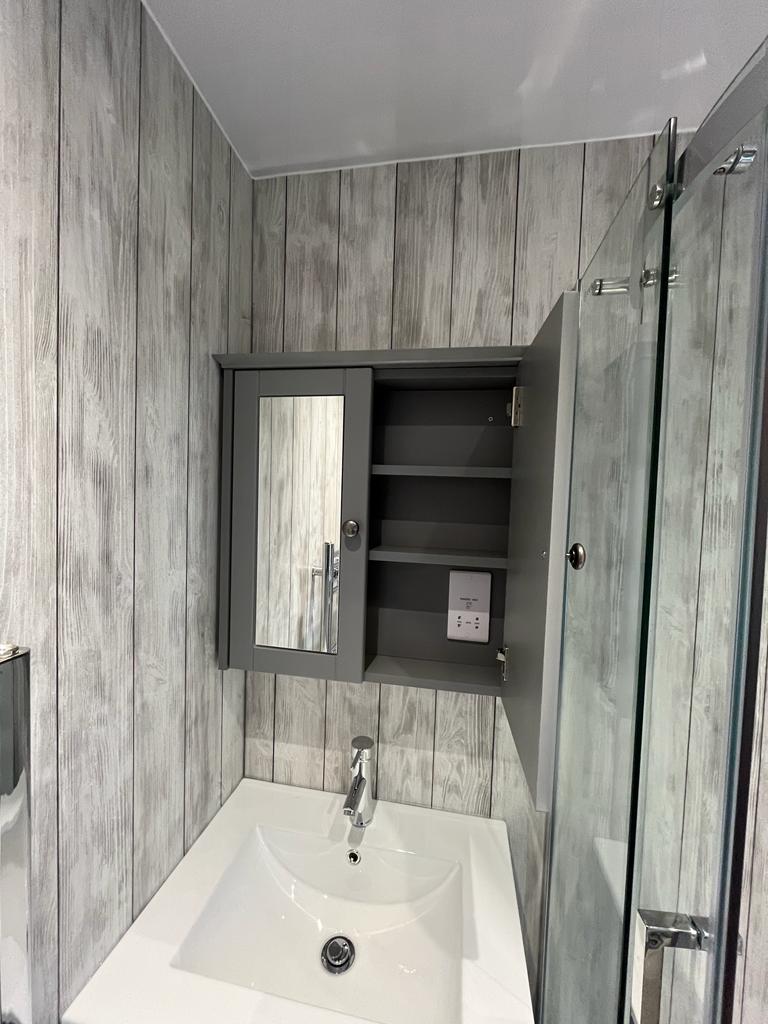 Marble walk-in shower and vanity
