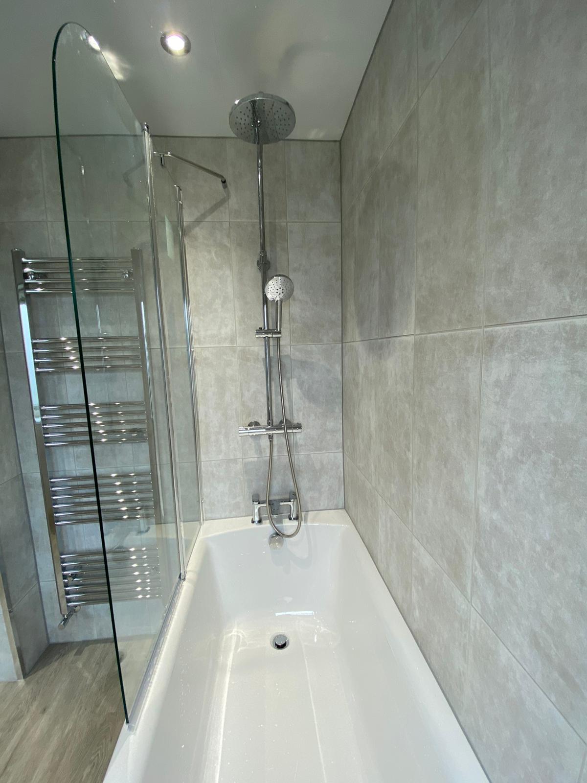 Light grey bathroom with dual-ended bath
