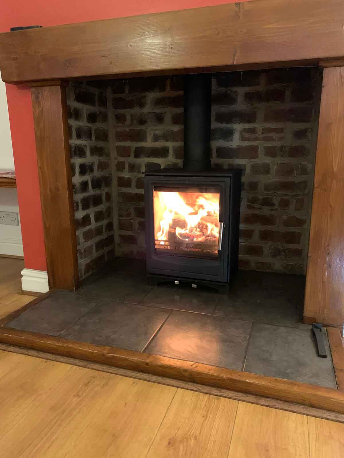 Log burner in inglenook